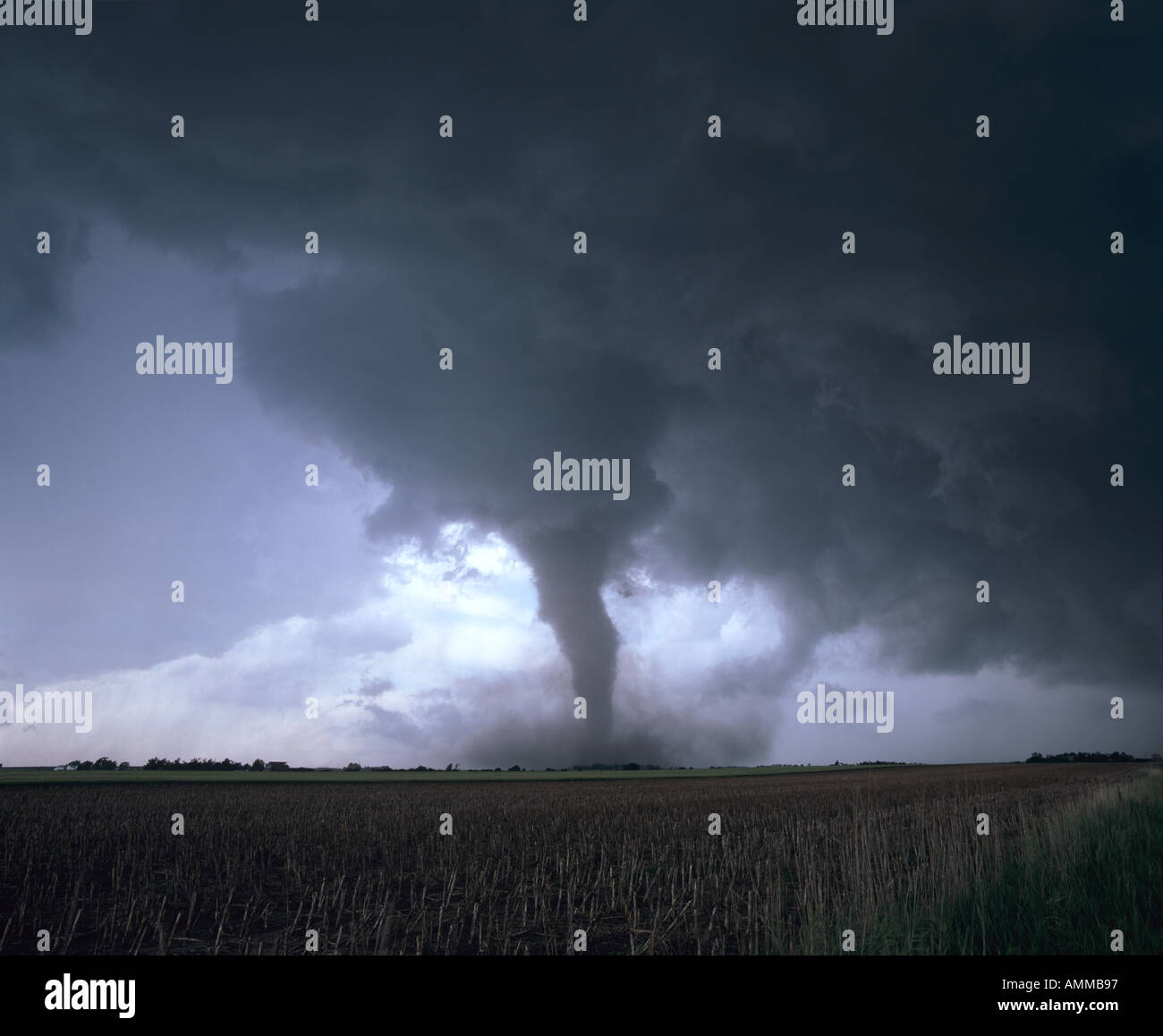 A tornado touches down from a supercell thunderstorm in farmland in Nebraska, USA Stock Photo