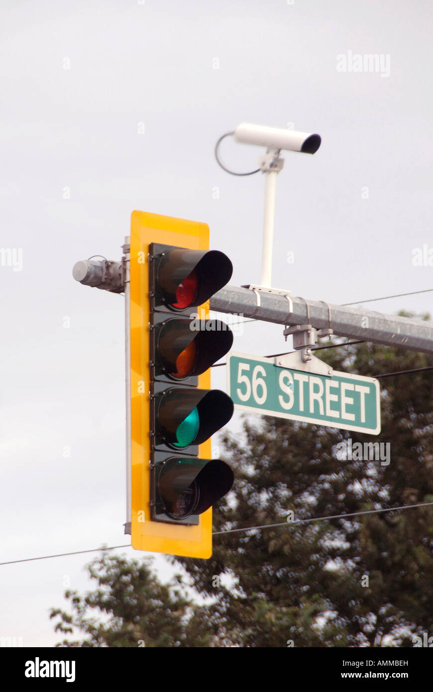 Traffic signal light with camera photographing traffic violations violators ticket record proof capture Stock Photo