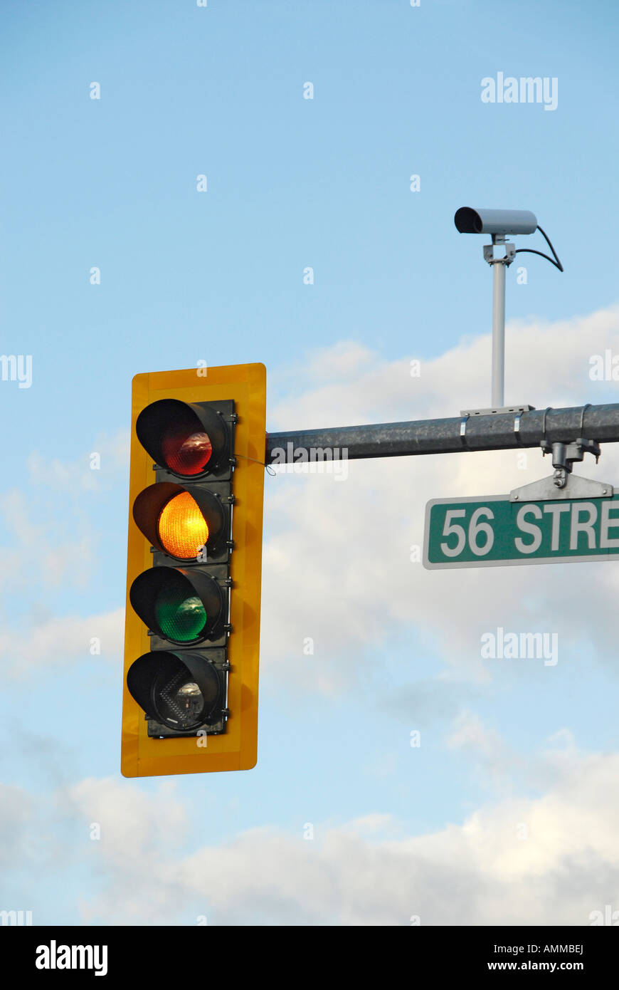 Traffic signal light with camera photographing traffic violations