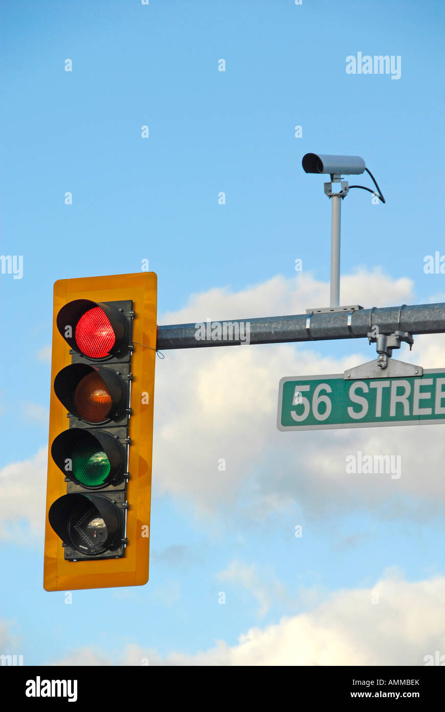 Traffic signal light with camera photographing traffic violations
