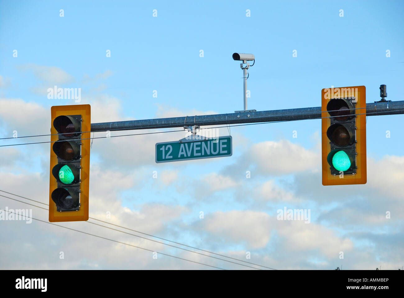 Traffic signal light with camera photographing traffic violations