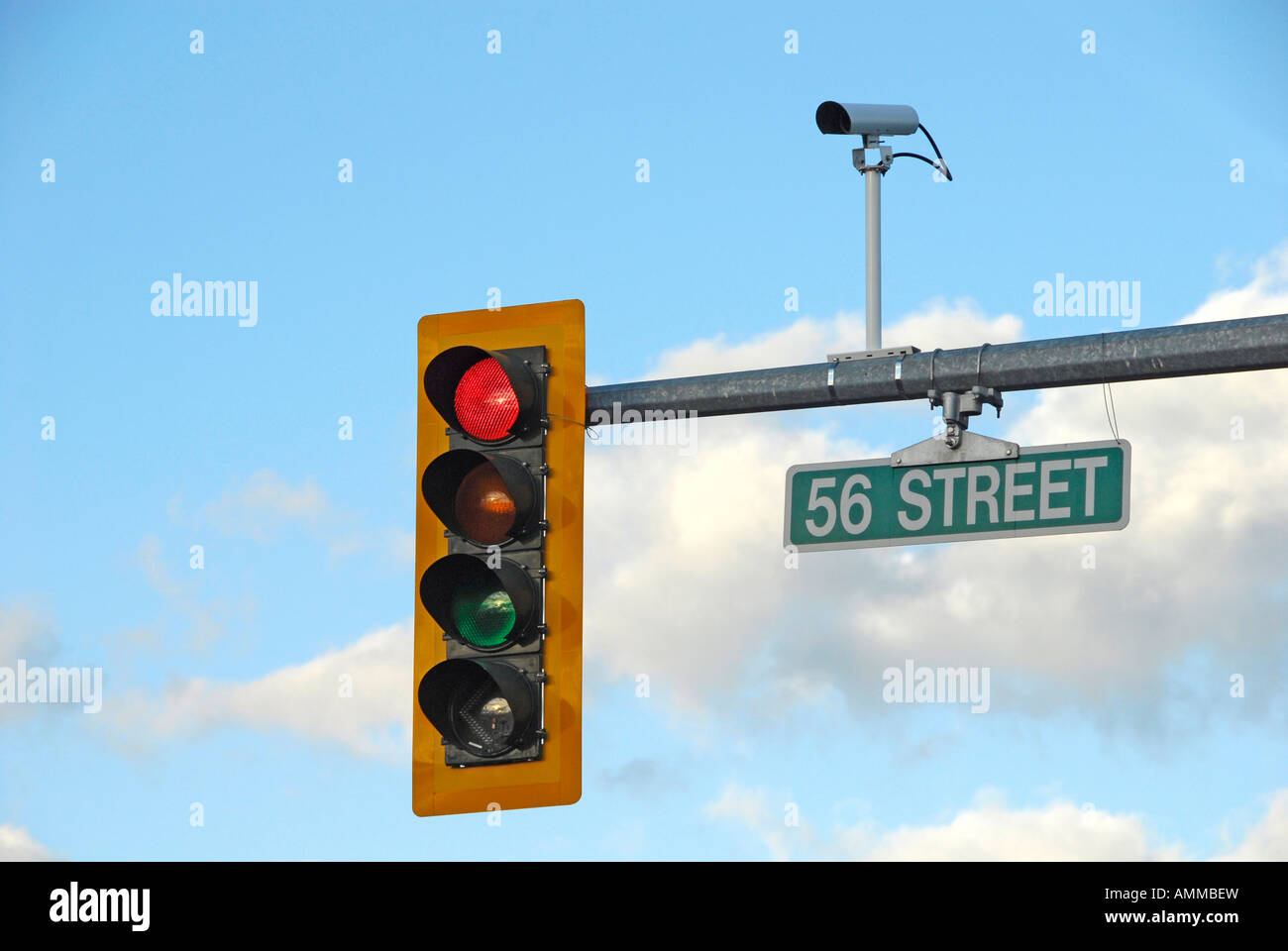 Traffic signal light with camera photographing traffic violations
