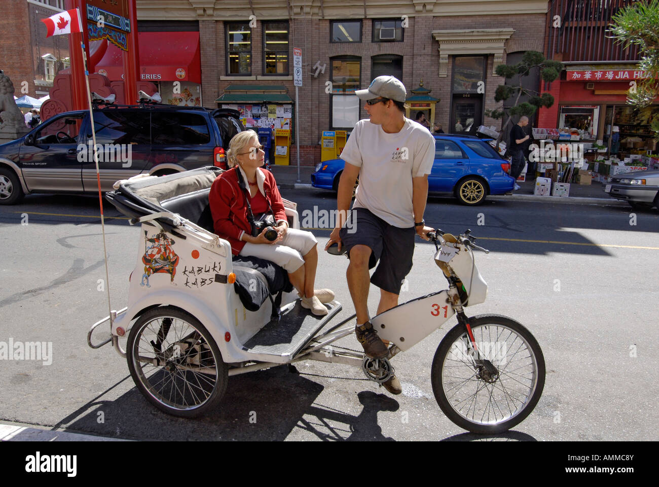 Tourist with Tour Guide in rickshaw in China Town Area of Victoria ...