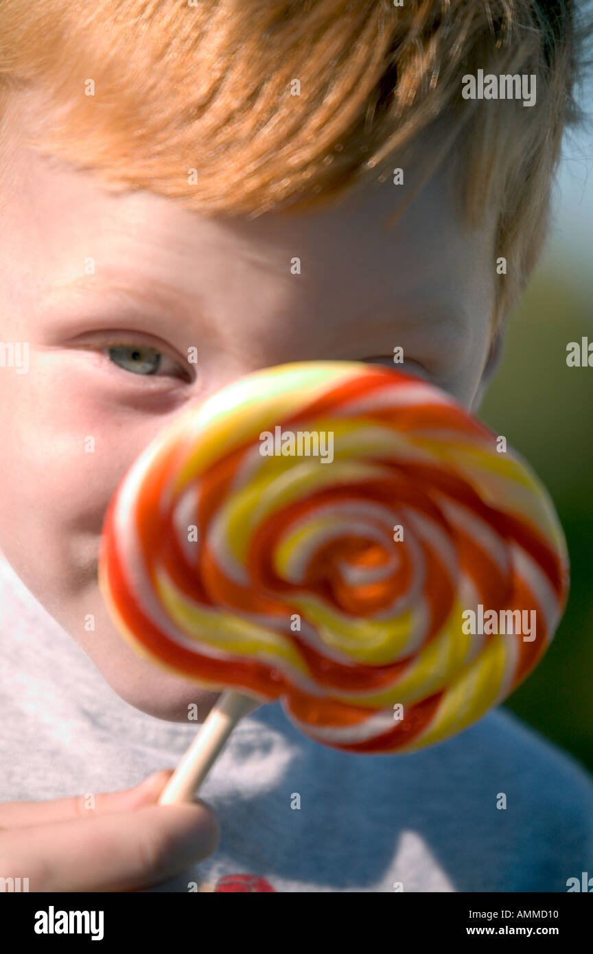 Young child with lollypop hi-res stock photography and images - Alamy