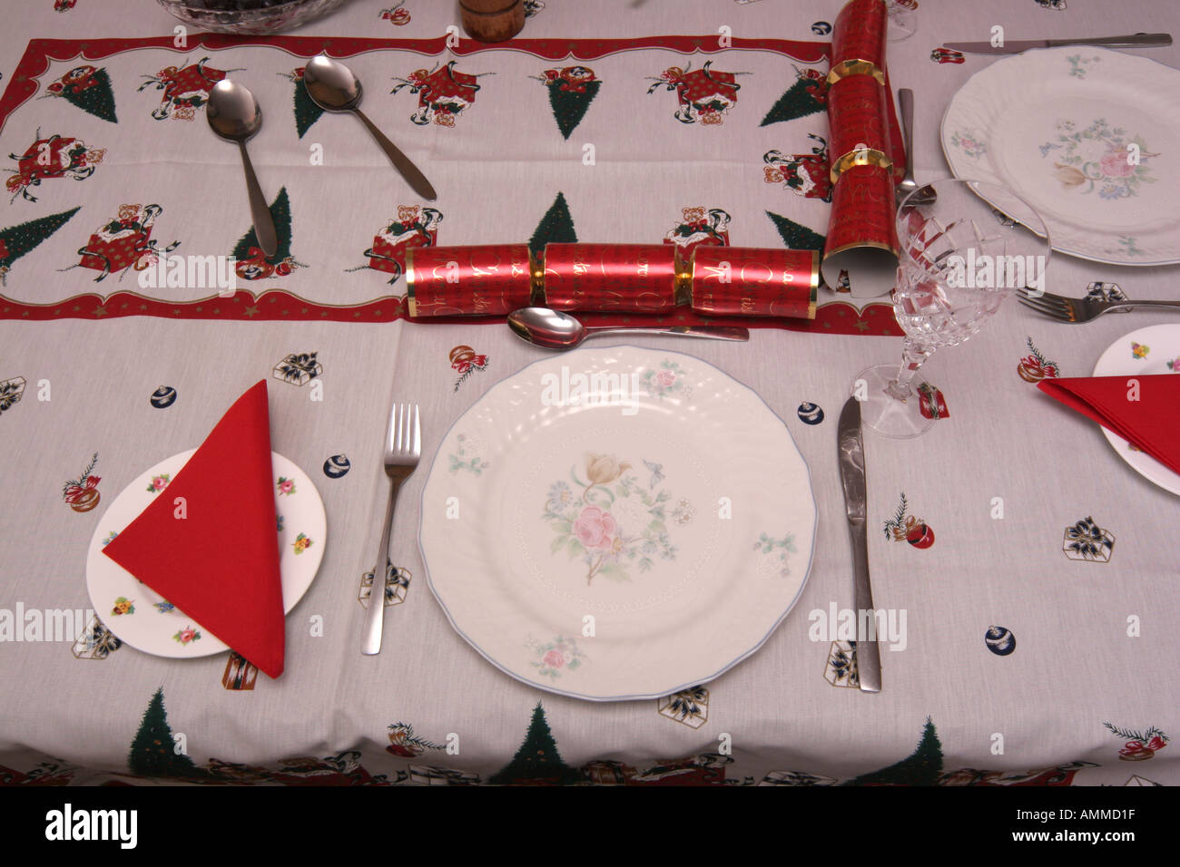 Christmas dinner lunch table set for meal decorated cracker Stock Photo