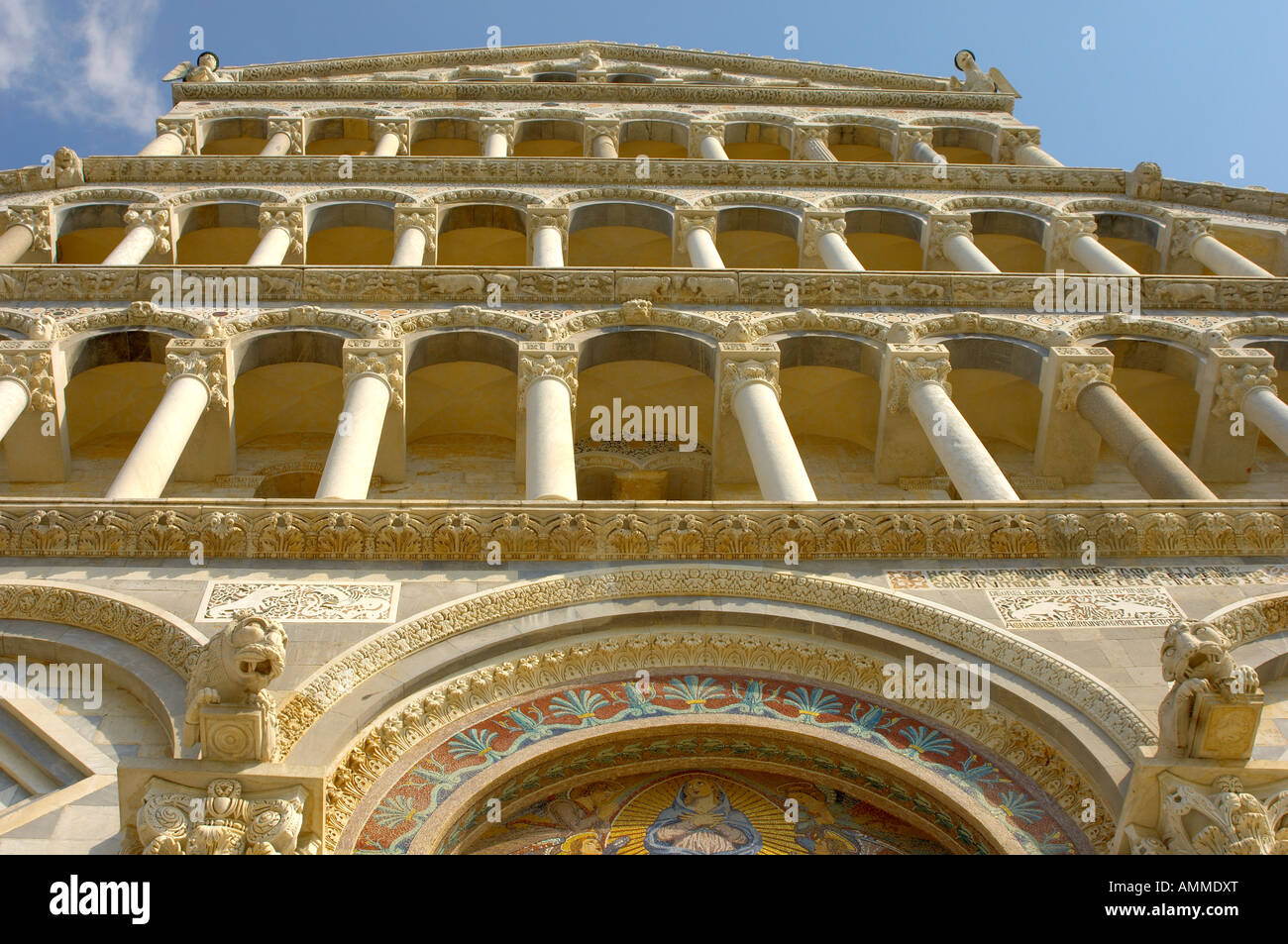 View of the Duomo of Pisa romanesque arcades on the cathedral facade. Piazza del Miracoli Pisa Italy Stock Photo