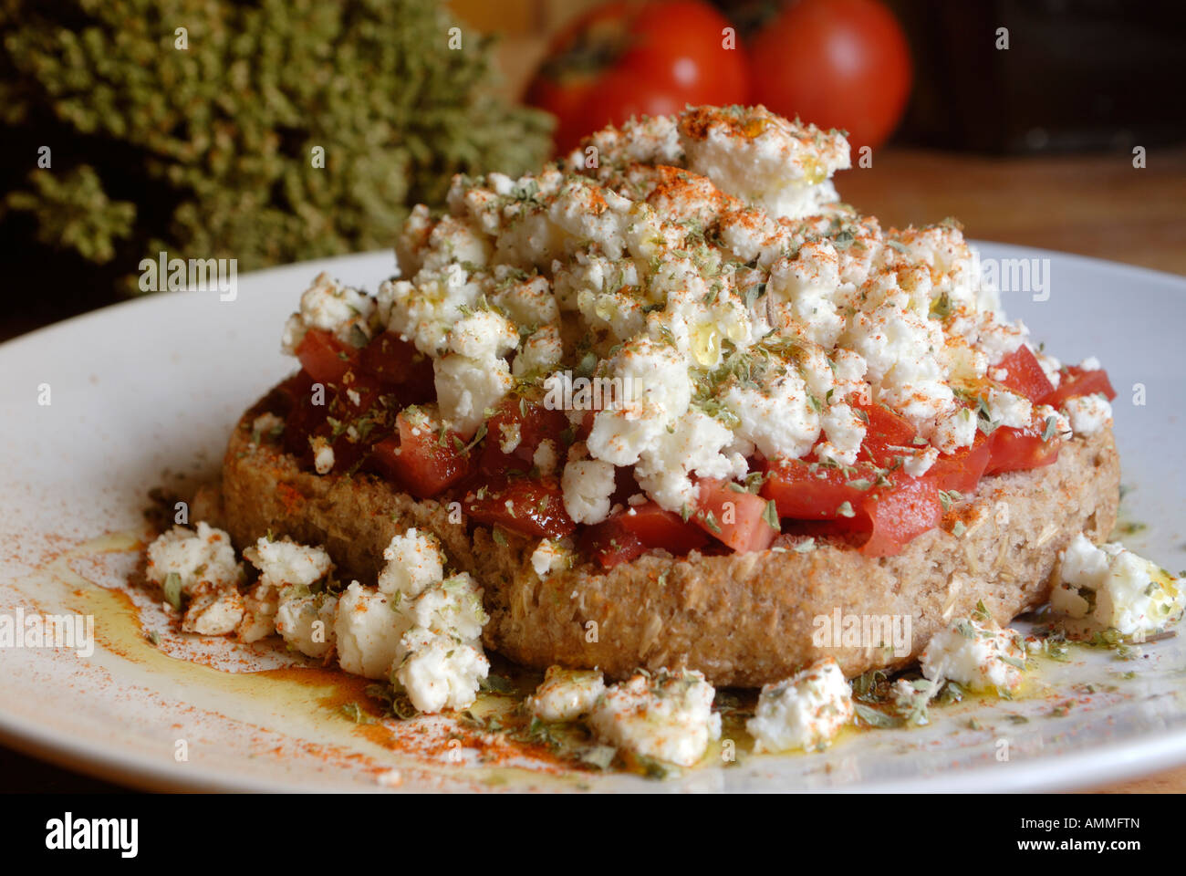 Dakos (Ntakos) traditional Greek starter common in Crete. Dried bread