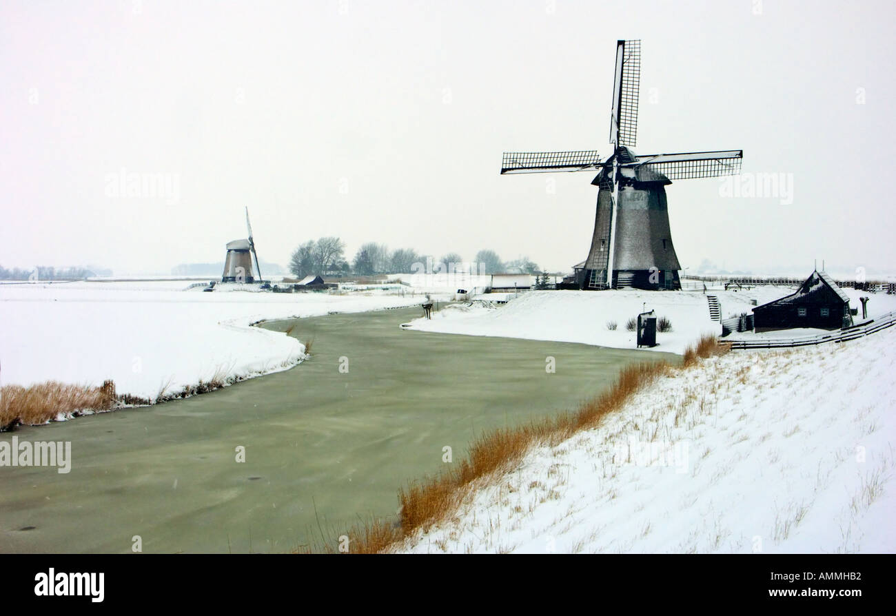 Windmills in winter landscape Stock Photo