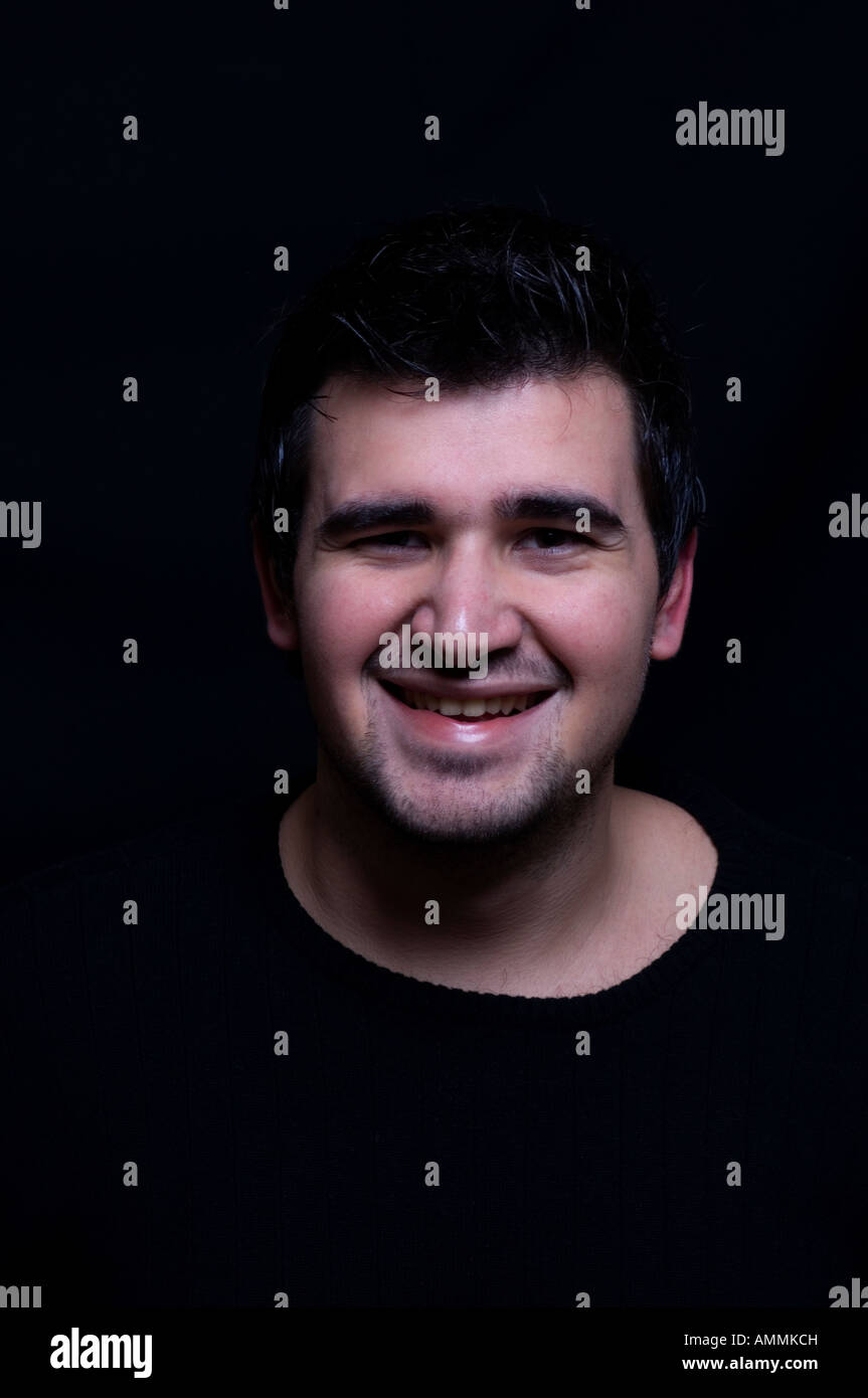 Portrait of a young man smiling Stock Photo - Alamy