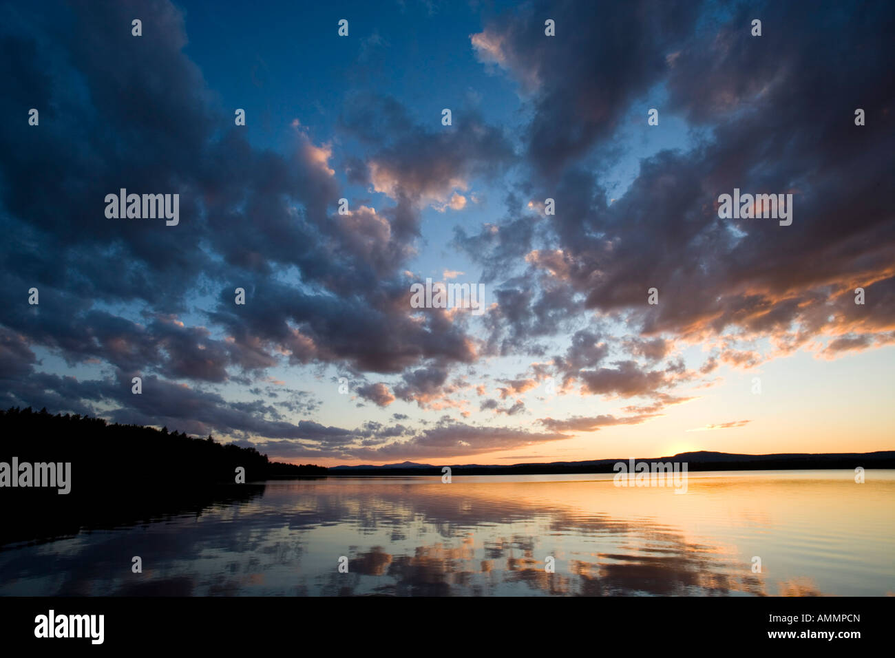 Sunset over Indian Pond Kennebec River near Greenville Maine Stock