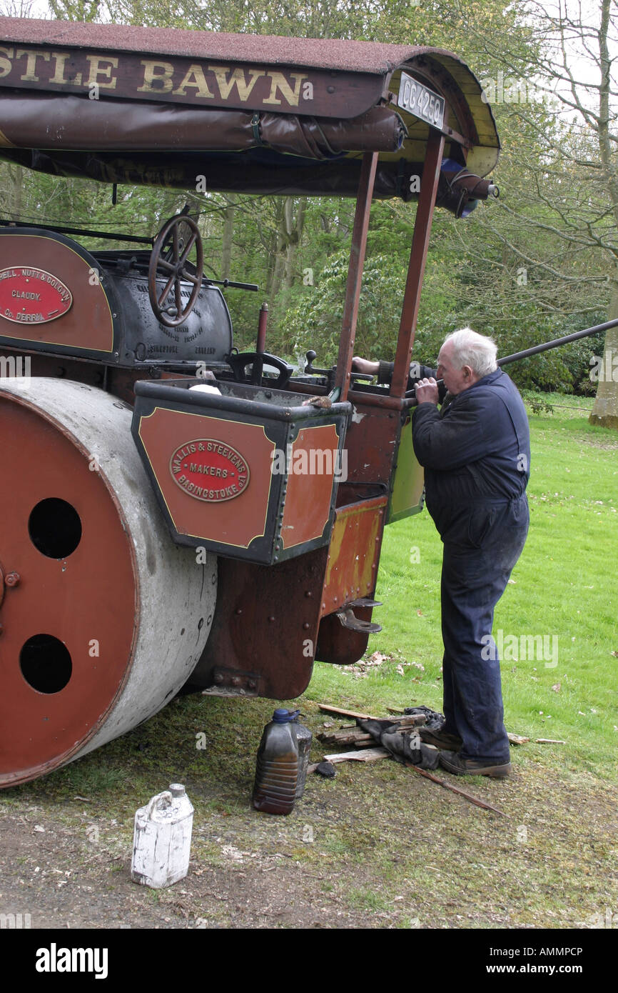 Old engineer tending to his traction engine at a show in Shane's Castle
