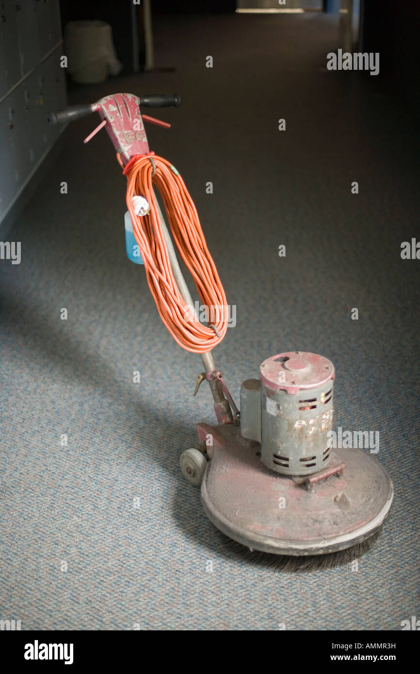 Floor polisher for wooden and vinyl floors waiting on a carpeted corridor Stock Photo Alamy