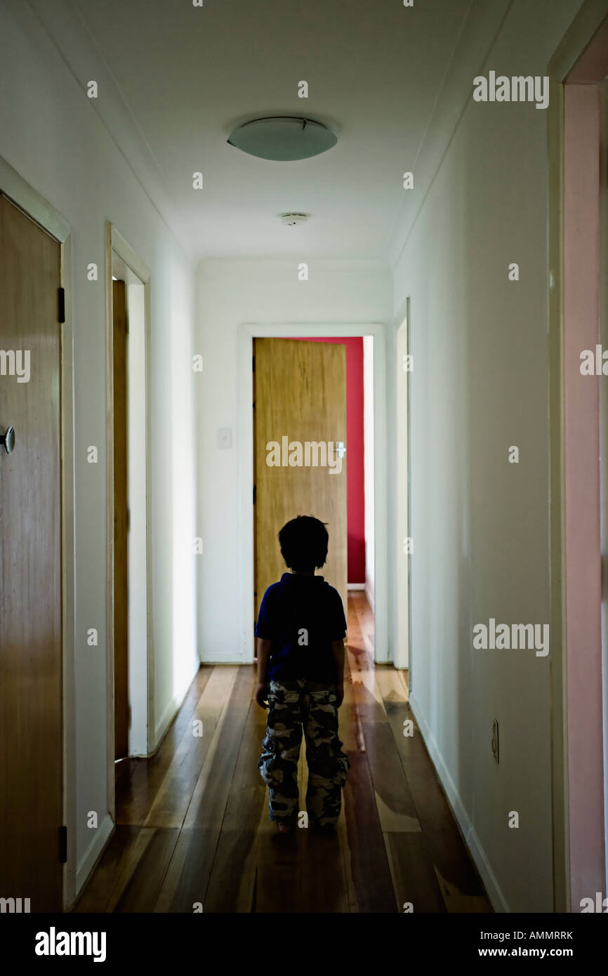 Hallway with boy standing Stock Photo Alamy