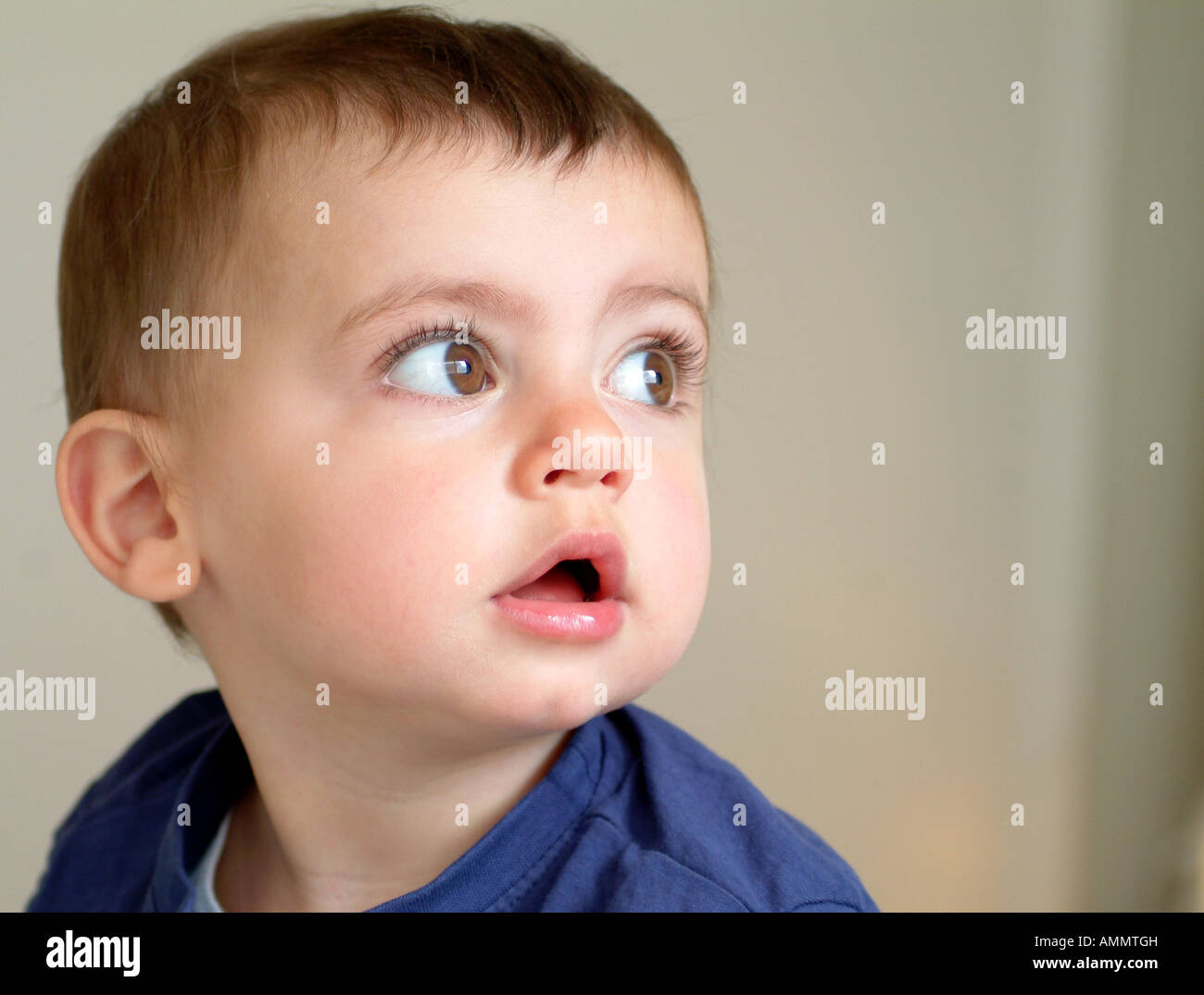 Cute baby looking upwards Stock Photo Alamy