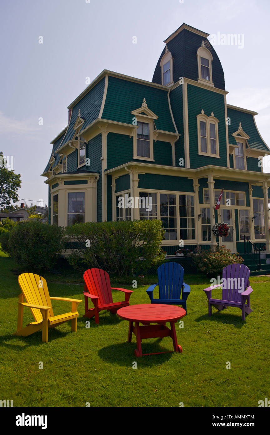 The Locke Homestead, with colourful wooden outdoor furniture on the lawn, lighthouse Route, Nova Scotia, Canada. Stock Photo