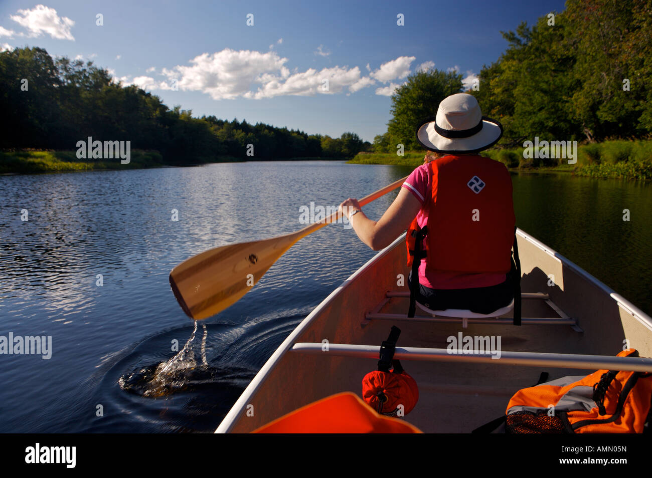 Paddling a canoe on the Mersey River in Kejimkujik National Park and