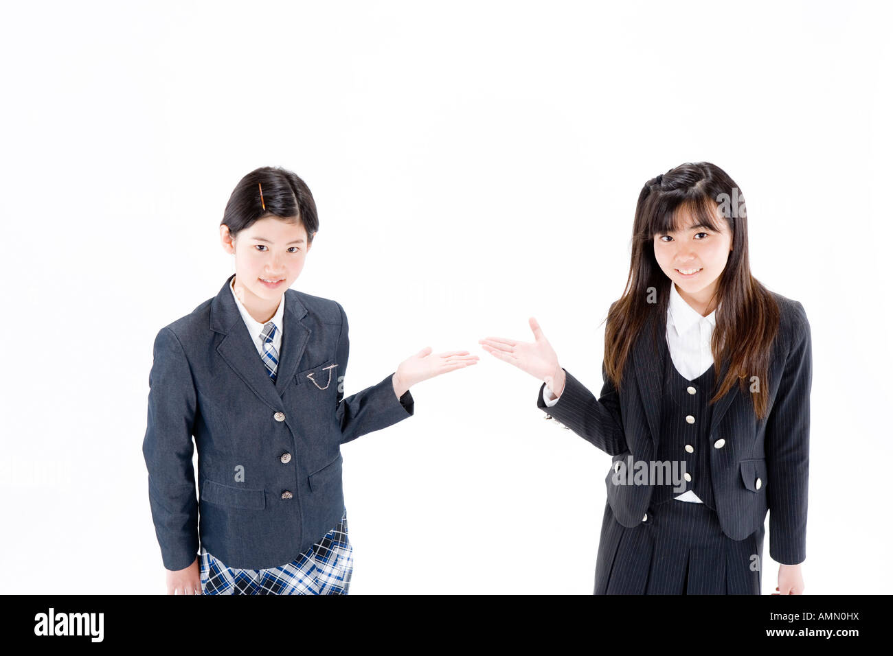 Two teenage girls introducing each other Stock Photo