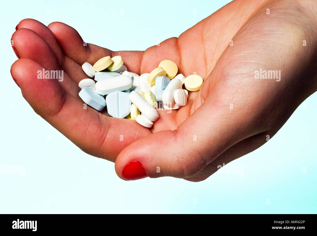Hand Holding Pills (trademarks and logos removed) Stock Photo