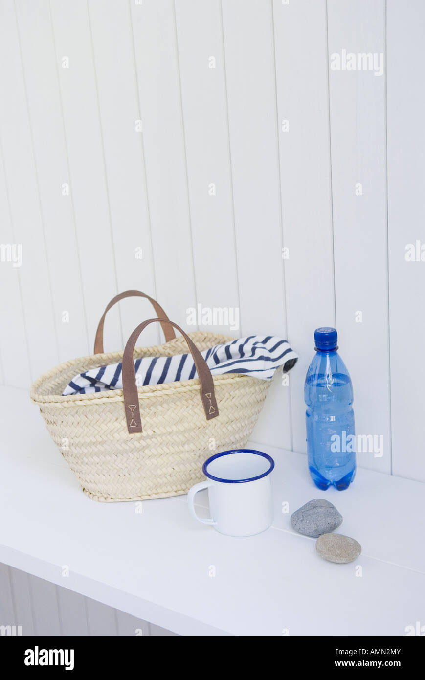Straw bag and mineral water Stock Photo Alamy