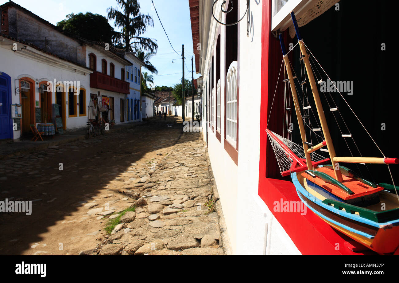 boat model at a window of the beautiful portuguese colonial typical town of parati in rio de janeiro state brazil Stock Photo