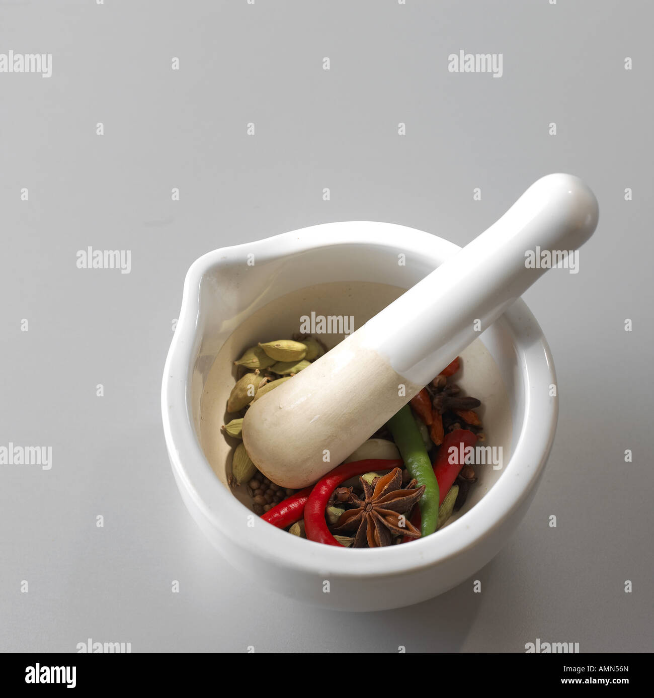 Pestle, mortar and indian spices Stock Photo