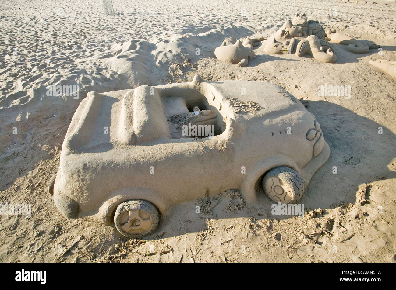 Sand castle of car with cup holder on beach of Durban South Africa