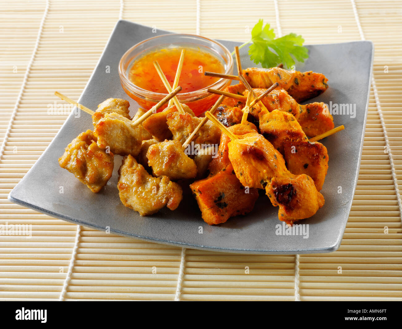 Chicken satay with chilli dipping sauce Stock Photo Alamy