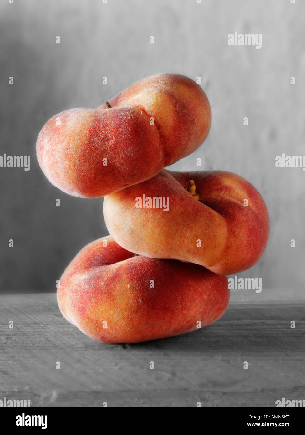 still life of a sick of fresh donut peaches Stock Photo
