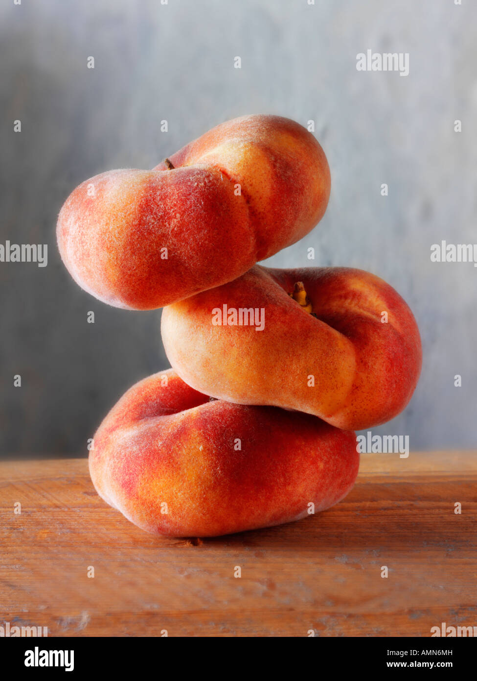 still life of a sick of fresh donut peaches Stock Photo