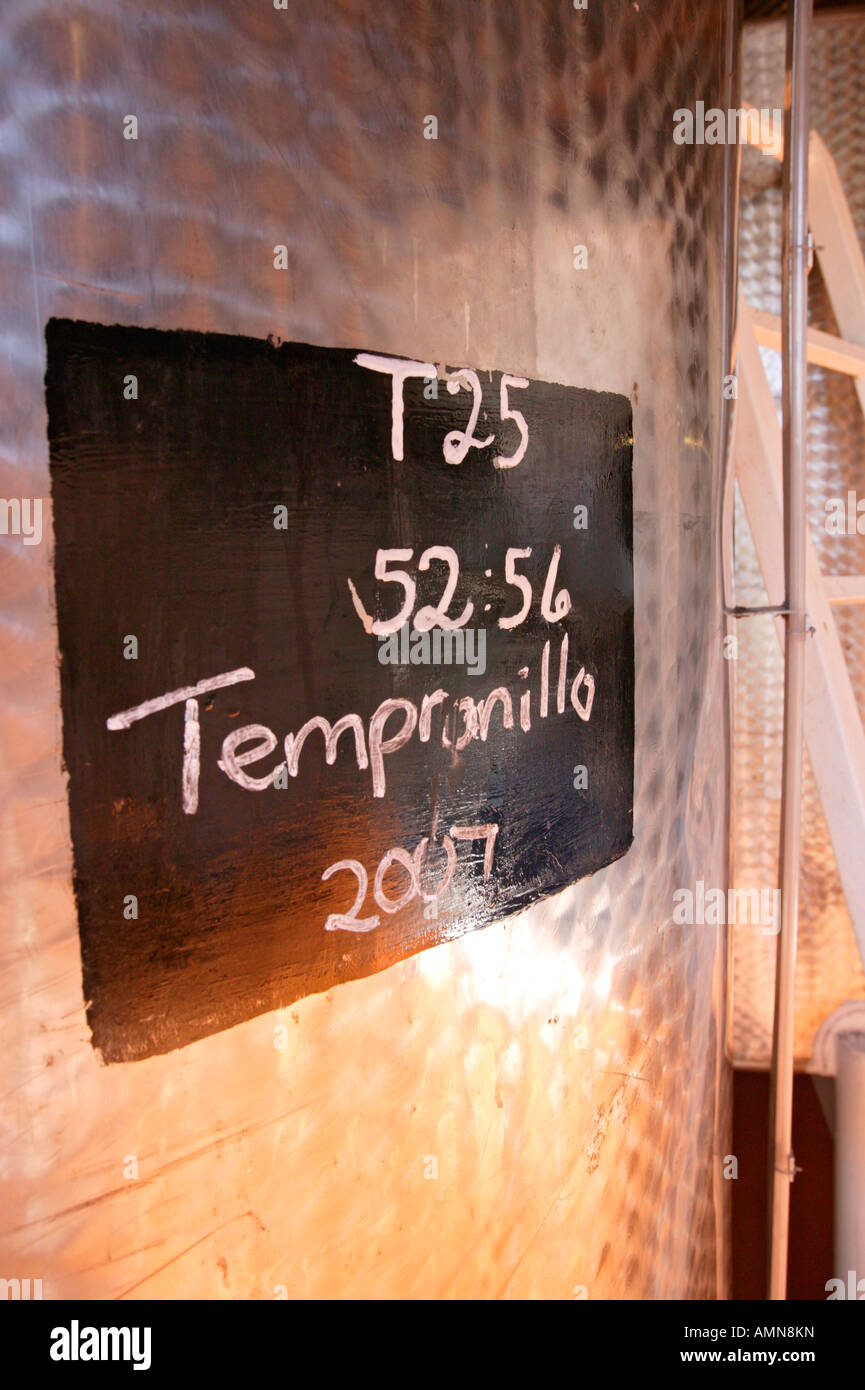 A stainless steel vat in which vintage port is being matured. Tempranillo is a Spanish grape variety used in red port. Stock Photo