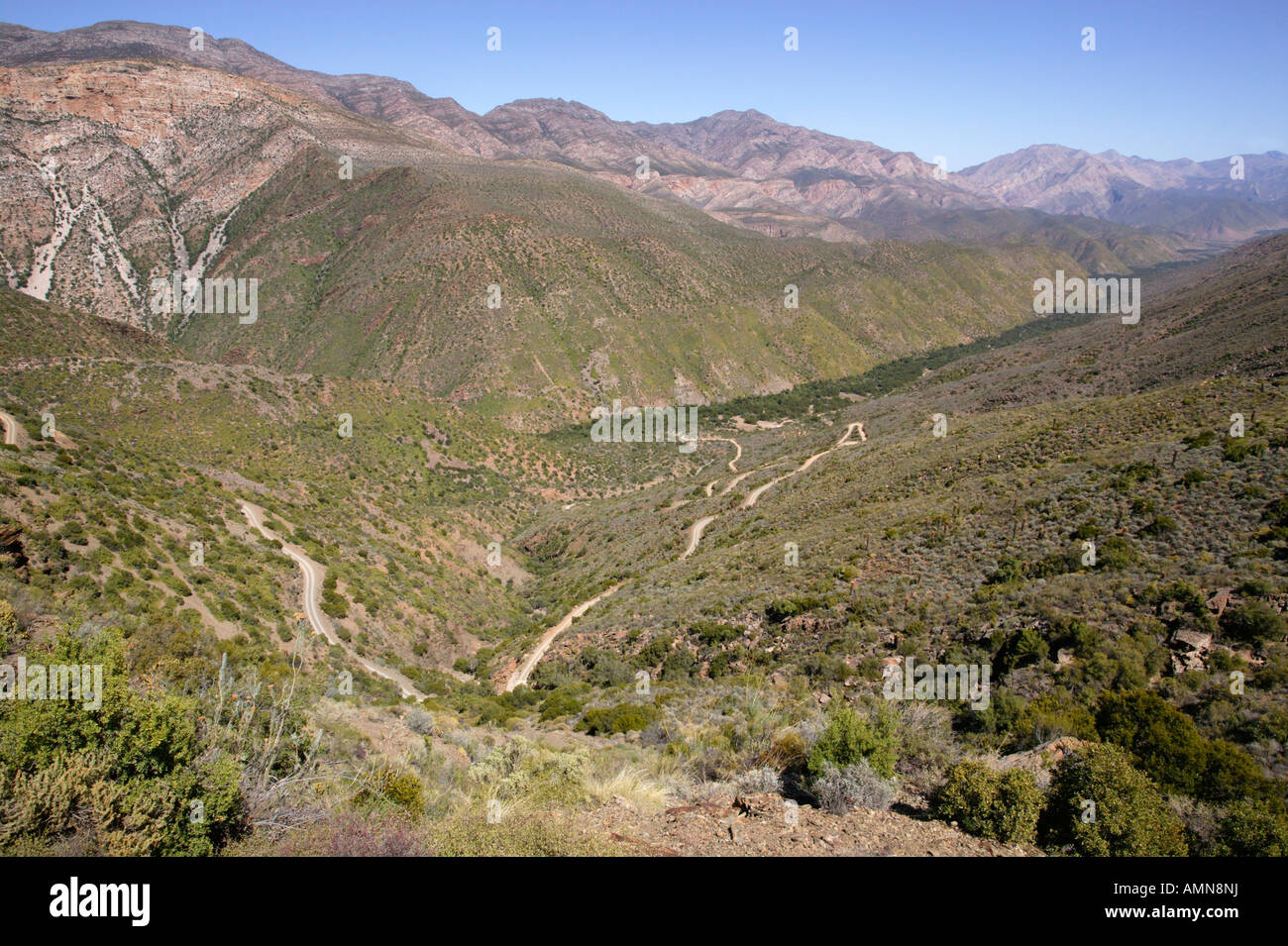 A scenic view of the hairpin bends on the road leading down into the Gamkaskloof or Die Hel from Swartberg Pass Stock Photo