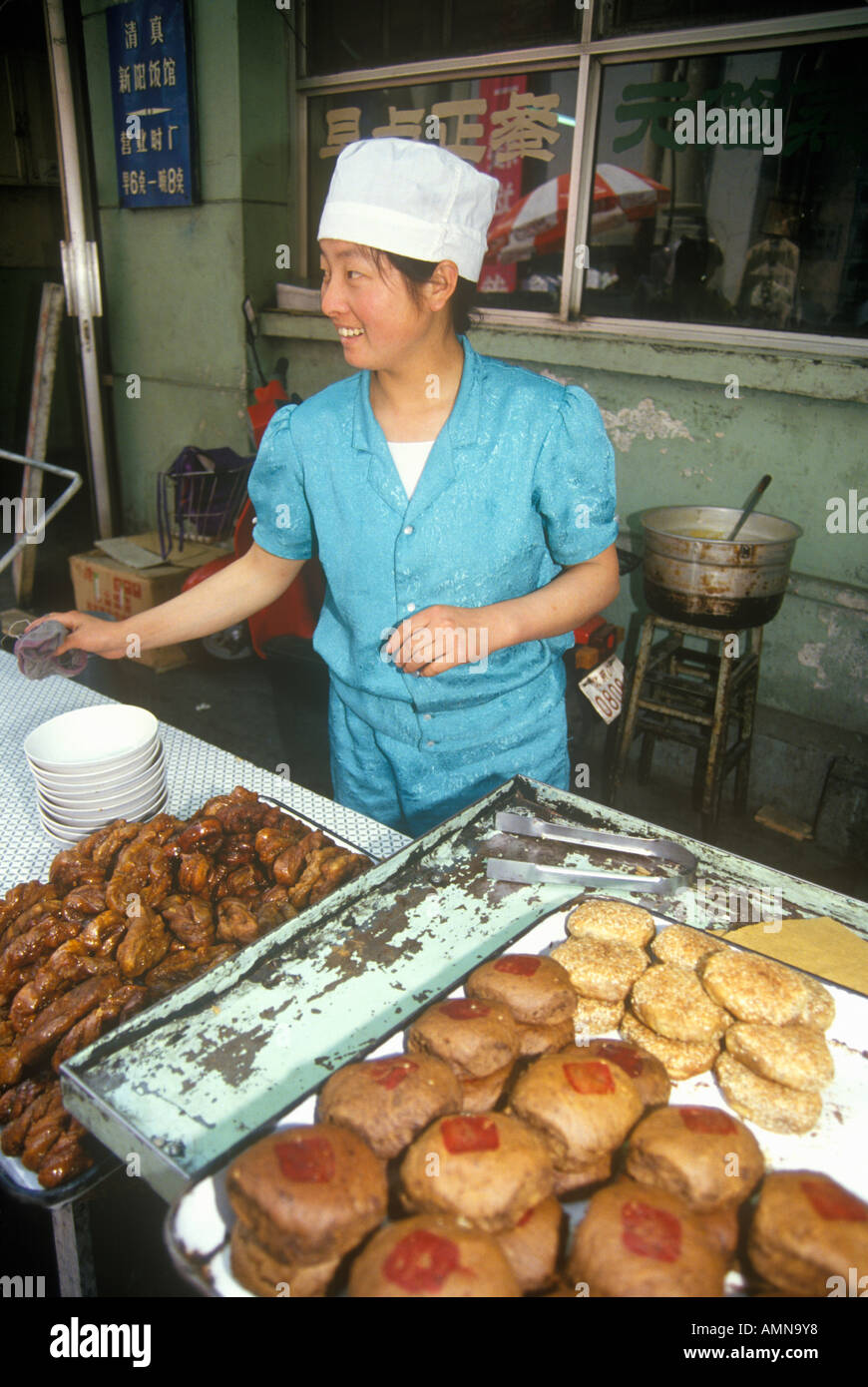 Baker with goods in the Hutongs in Beijing in Hebei Province People s Republic of China Stock Photo
