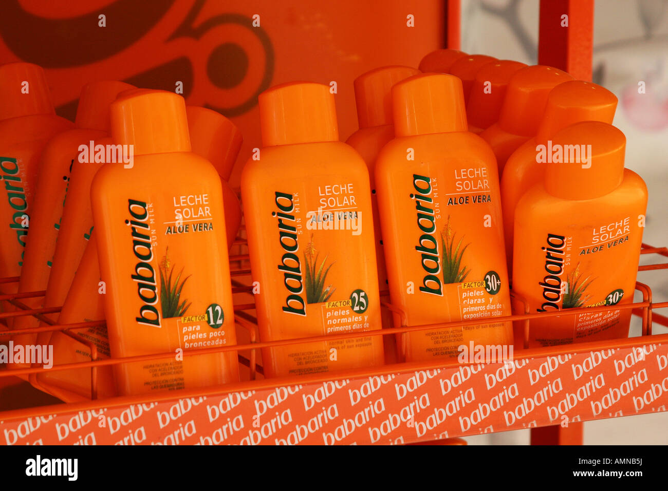 Sun tan lotion for sale on a stand outside a shop in Palma Nova Stock