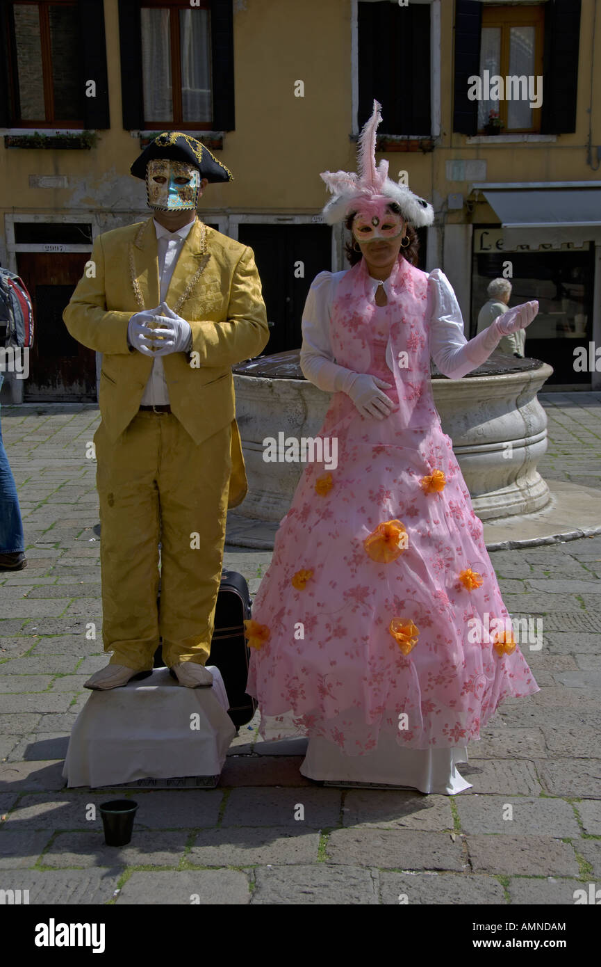 Venetian couple wearing masks San Polo Venice Italy April 2007 Stock Photo