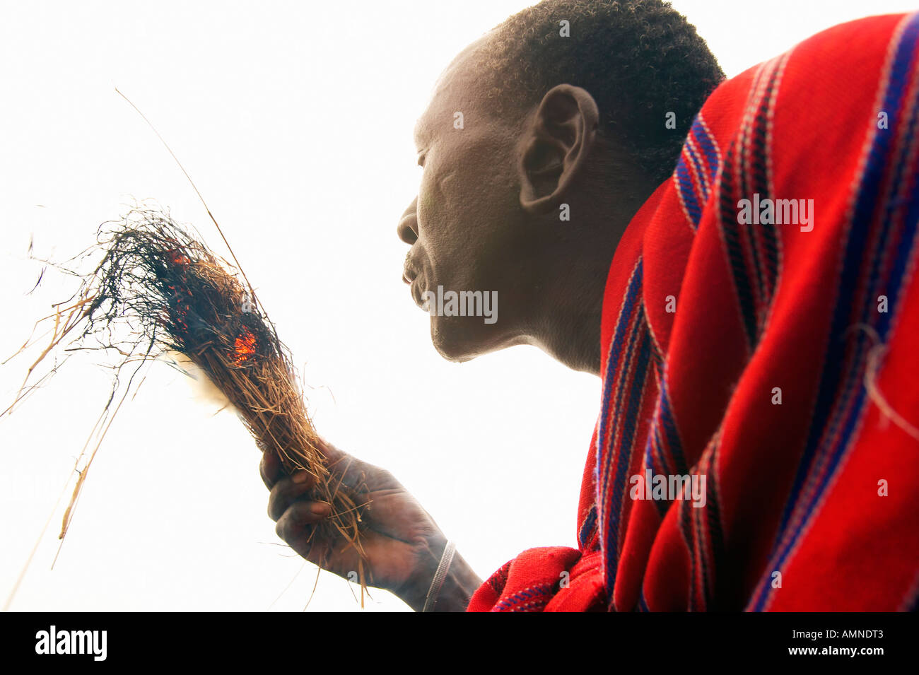 Rubbing sticks together to make fire hires stock photography and