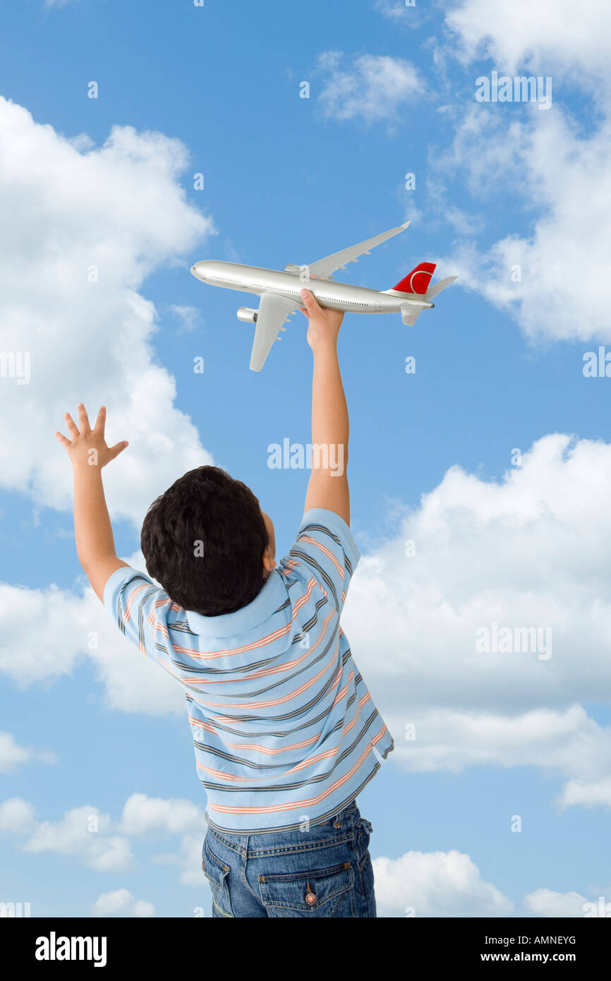 Boy Playing with Toy Airplane Stock Photo