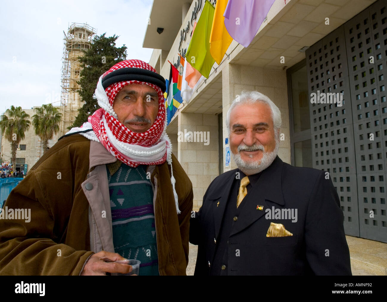 Palestinian Authority Bethlehem Manger Square portrait of an elegant christian man and a muslem wearing the keffieh both smilling Stock Photo