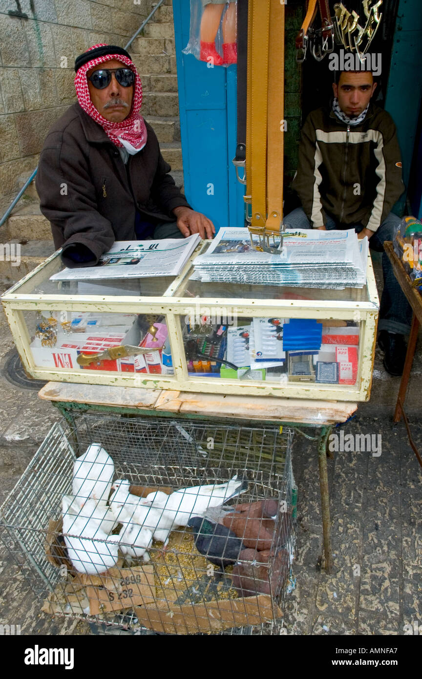 Palestinian Authority Bethlehem Manger Square blind palestinian man selling newspapers cigarettes and doves Stock Photo