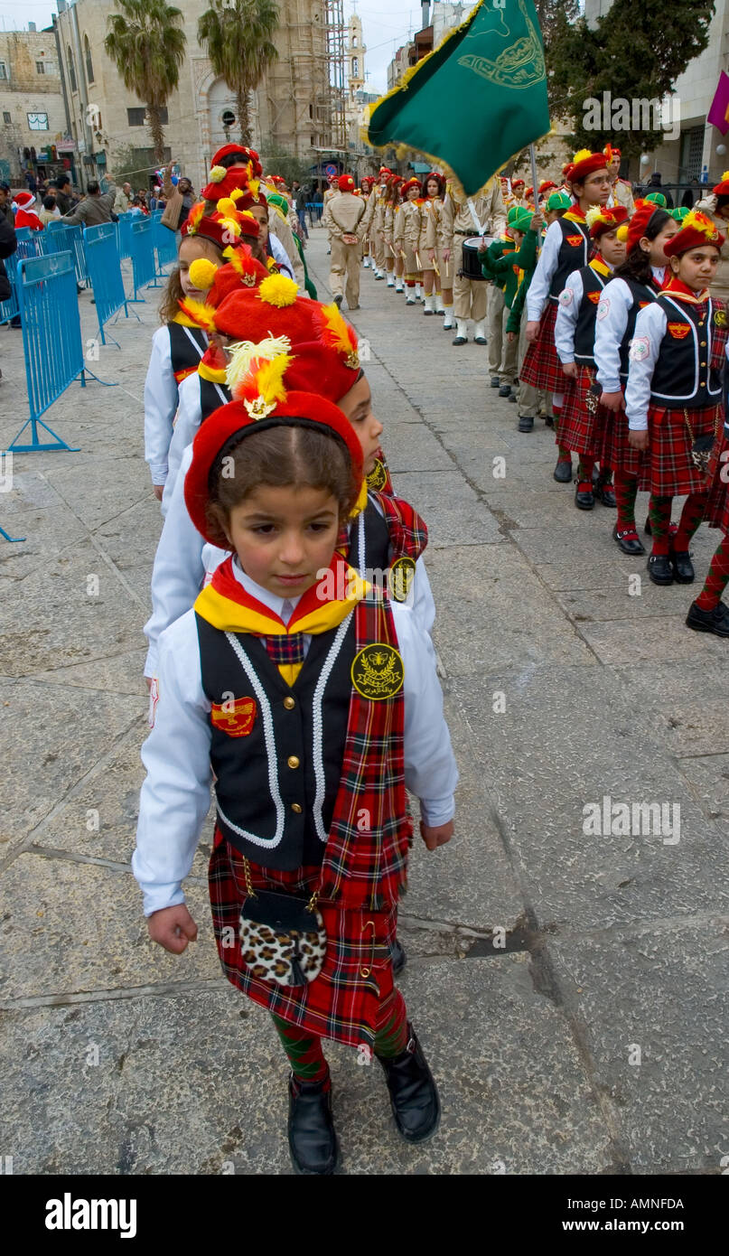 Palestinian Authority Bethlehem Manger Square young scout girls in uniform marching in front of peace center  Stock Photo