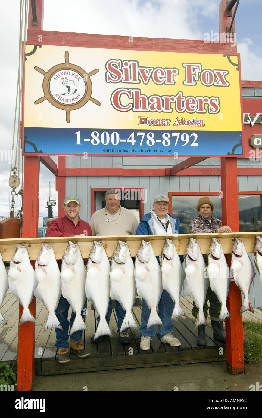 ALASKA HOMER HALIBUT FISHING FISHERMAN WITH CATCH OF THE DAY SILVER FOX