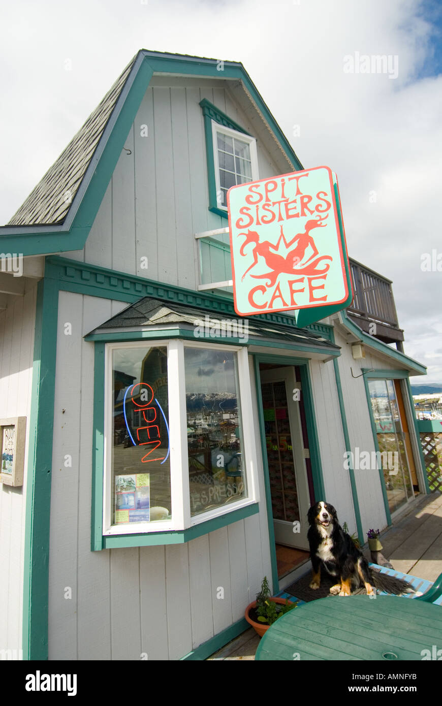ALASKA HOMER SPIT SISTERS COFFEE SHOP WITH DOG POSING AT THE FRONT DOOR