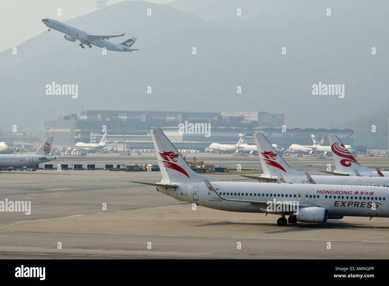 Hong Kong Express Airplane and Cathay Pacific Jet Taking Off at HKG Hong Kong International Airport Stock Photo