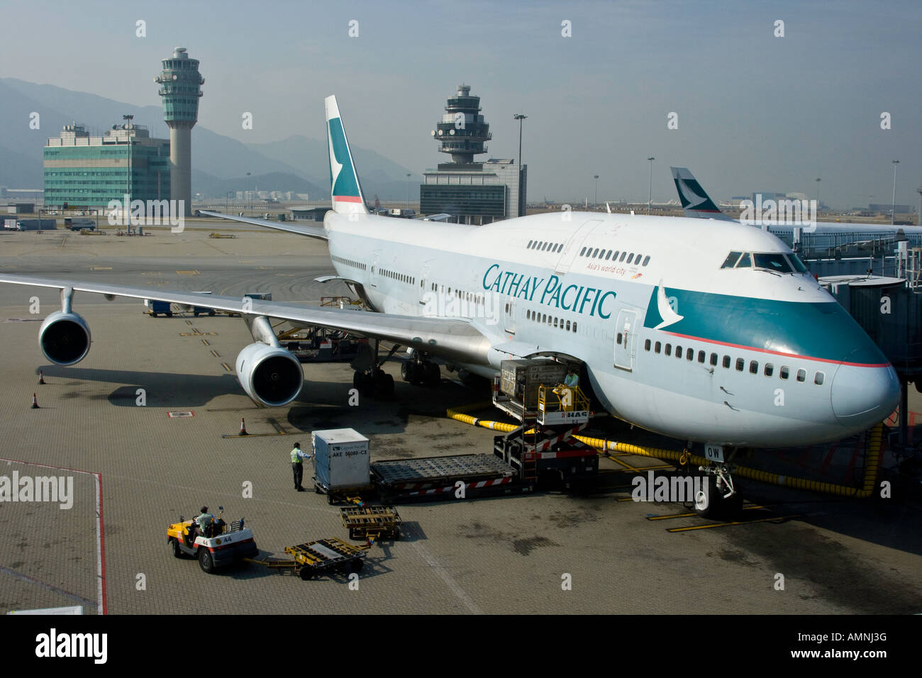 Loading Cargo into a Cathay Pacific Passenger Plane HKG Hong Kong International Airport Stock Photo
