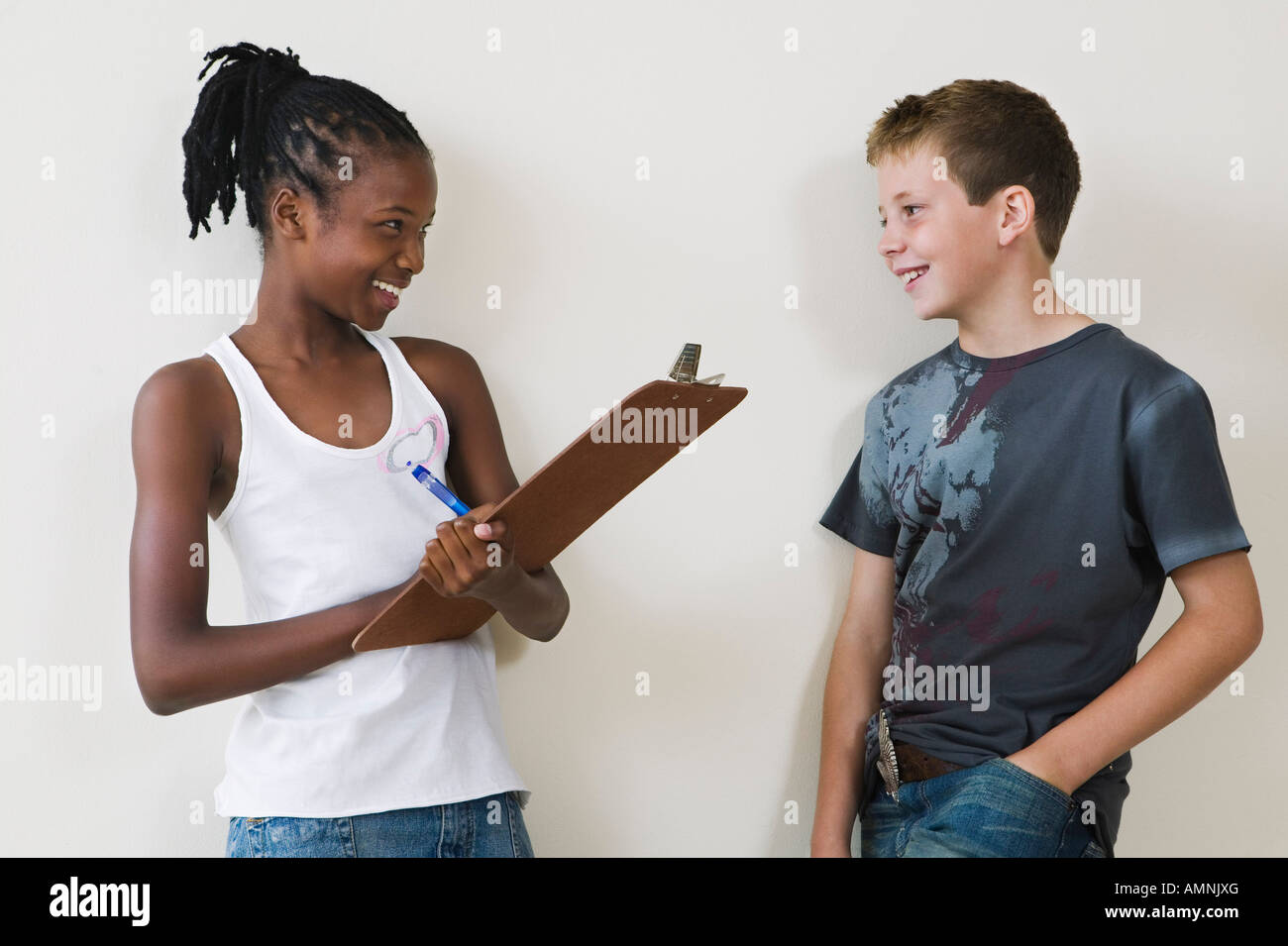 10 year old girl with 12 year old boy hires stock photography and