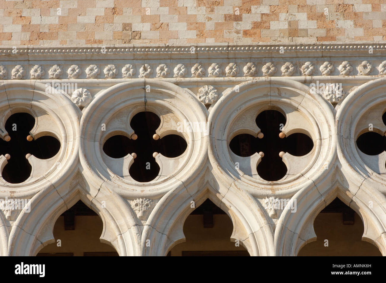Architectural detail of the Gothic style stone work on the top of columns on the facade of the Doge's Palace Venice, Italy. Stock Photo