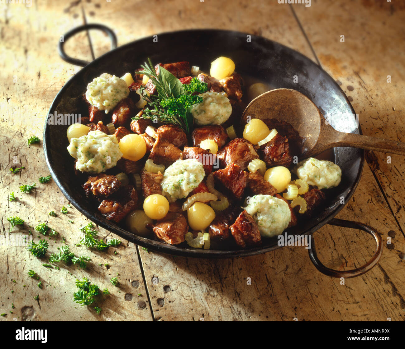 Traditional British Beef Stew and  dumplings in a pan have been cooked and ready to serve Stock Photo