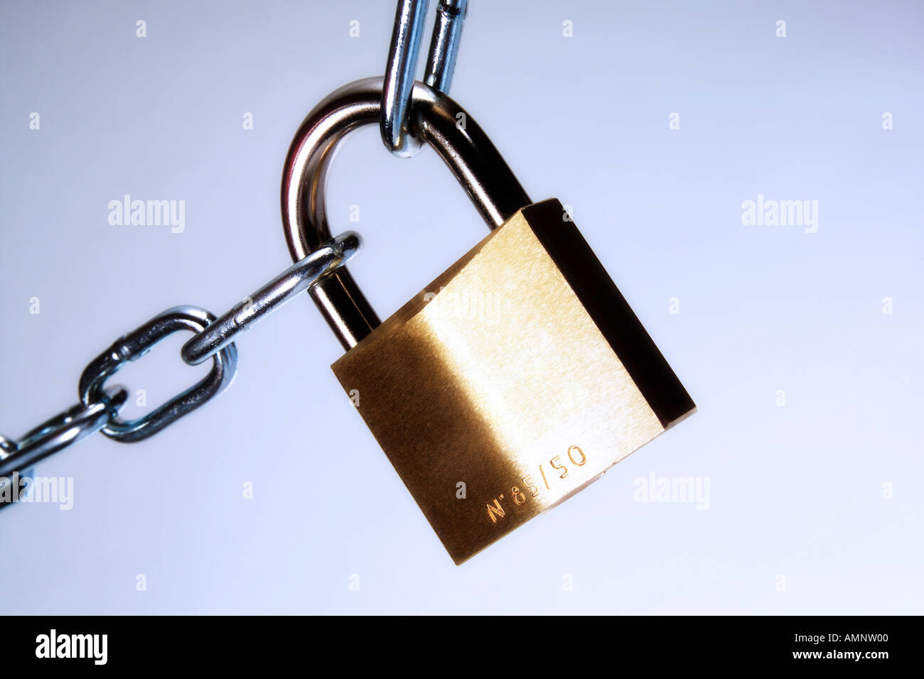 padlock connecting two chains, cutout, white background Stock Photo Alamy