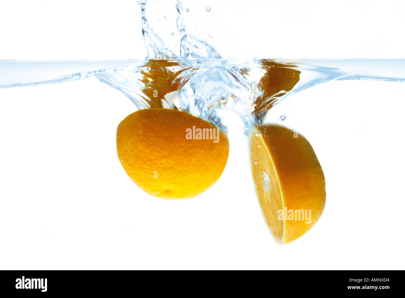 Oranges splashing into water Stock Photo Alamy