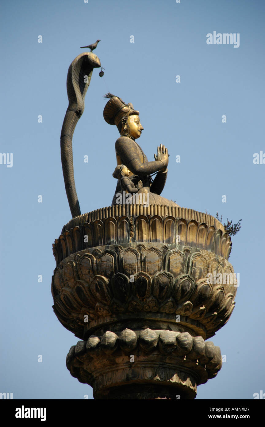 Statue of king Yoganarendra Malla with snake and bird Patan Kathmandu Nepal Stock Photo