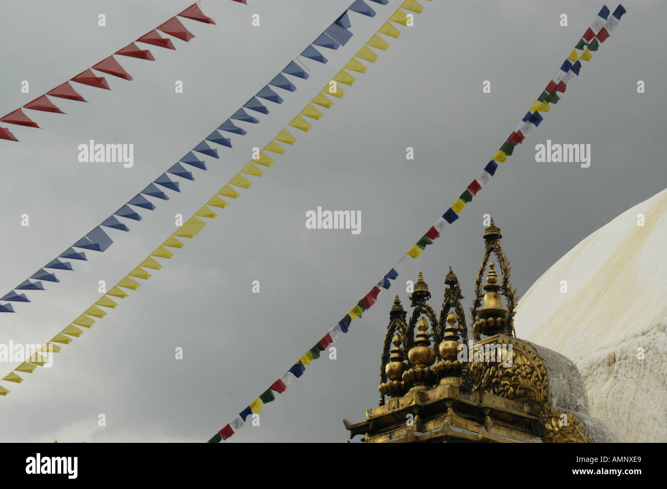 Coloured prayer flags at a dark sky at stupa Swayambhunath Kathmandu Nepal Stock Photo
